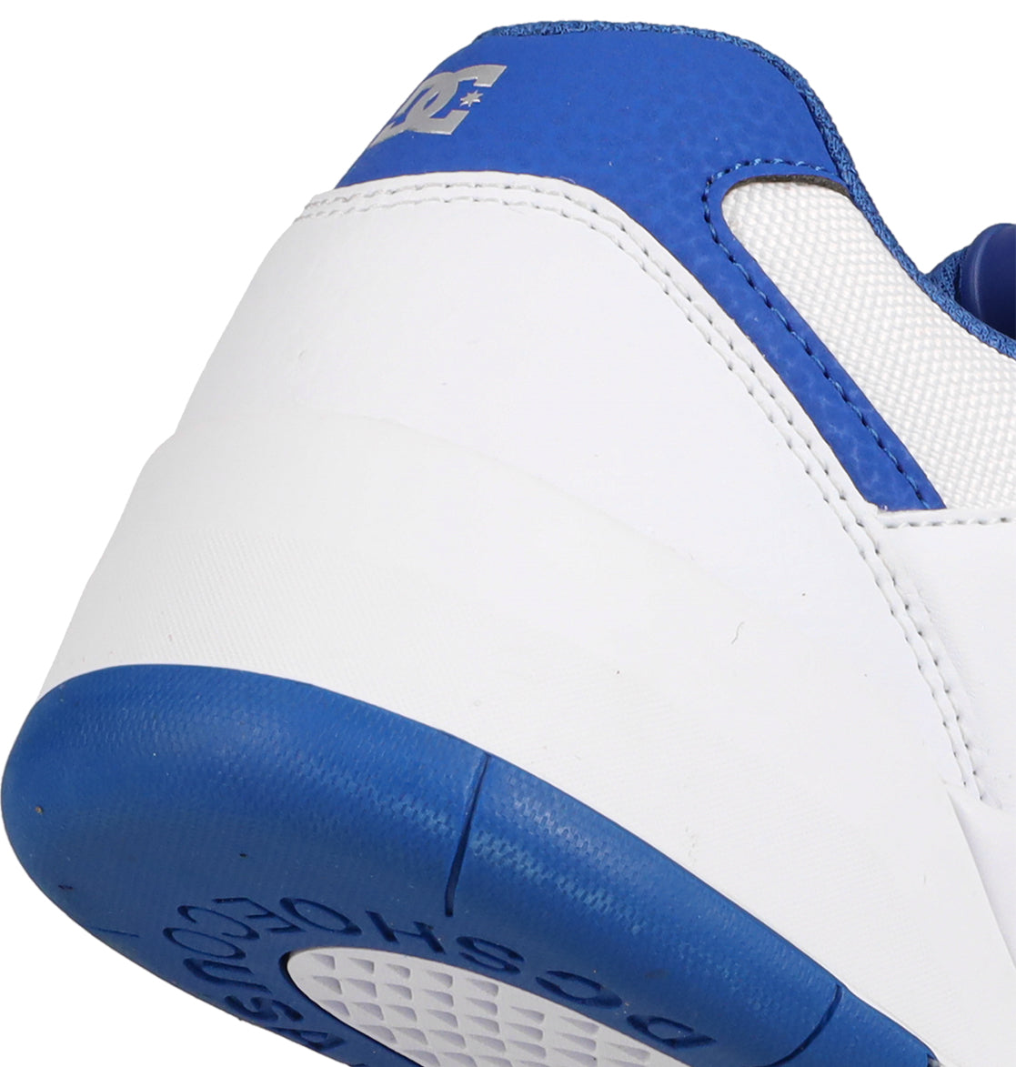 Close-up of the heel on DC Shoes Men's Fractal S, featuring textured blue material on the collar and sole. A partial DC logo appears on the heel tab, showcasing its street-ready style.