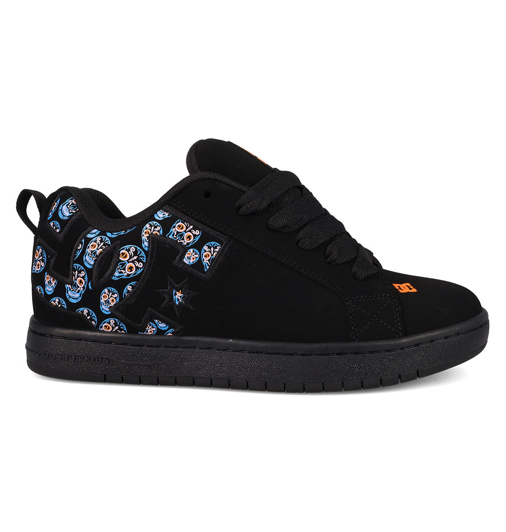 The Men’s Court Graffik Day Of The Dead skate shoe from DC Shoes features a sleek black design with matching laces and sole, accented by vibrant blue, orange, and white patterned details on the heel and side inspired by Día de los Muertos. An orange DC Shoes logo is showcased on the tongue and near the toe.