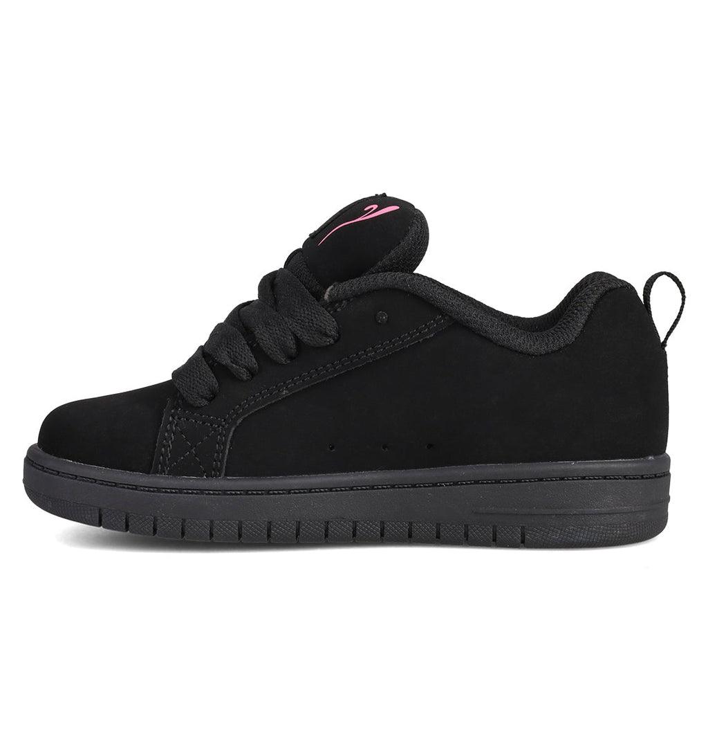 The DC Shoes Kids’ Court Graffik Day Of The Dead is a black skate shoe from the Day of the Dead Collection, featuring thick laces, a flat rubber sole, and a small pink logo on the tongue inspired by Día de los Muertos motifs, displayed in a side profile view.