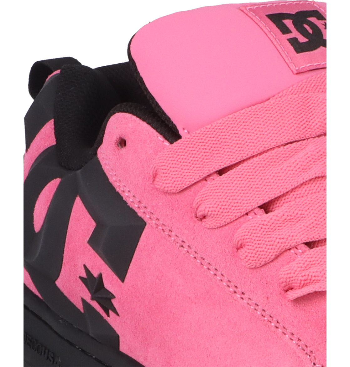 Close-up of the Men’s Court Graffik Beveled Special Edition Shoes by DC Shoes, showcasing a pink colorway with black accents, pink laces, and prominent black DC branding on the side. The sneaker features suede material, a signature puffy silhouette inspired by the Court Graffik Beveled collection, and a padded tongue adorned with branding.