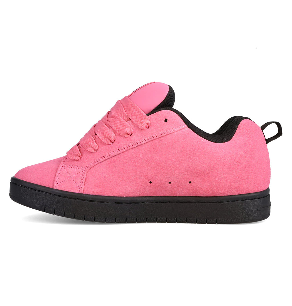 Showcased in a left side profile against a crisp white background, the Men’s Court Graffik Beveled Special Edition Shoes by DC Shoes feature a pink suede upper with matching pink laces, a black pull tab, and a black rubber sole. This image highlights the sneaker’s signature puffy silhouette and subtle DC branding.