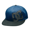 The DC Shoes Offset Flexfit is a blue and black flat-brimmed cap featuring a large black and gray DC logo on the front.