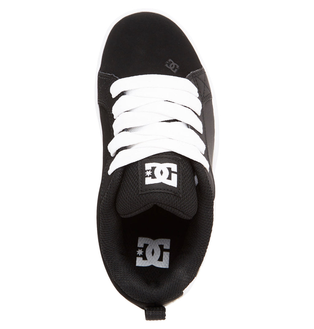 Black DC Shoes Kids’ Court Graffik shoe with white laces, seen from above. Featuring the brand’s signature puffy silhouette for kids, the DC logo is visible on both the tongue and insole. The shoe includes a rounded toe and padded collar for comfort.
