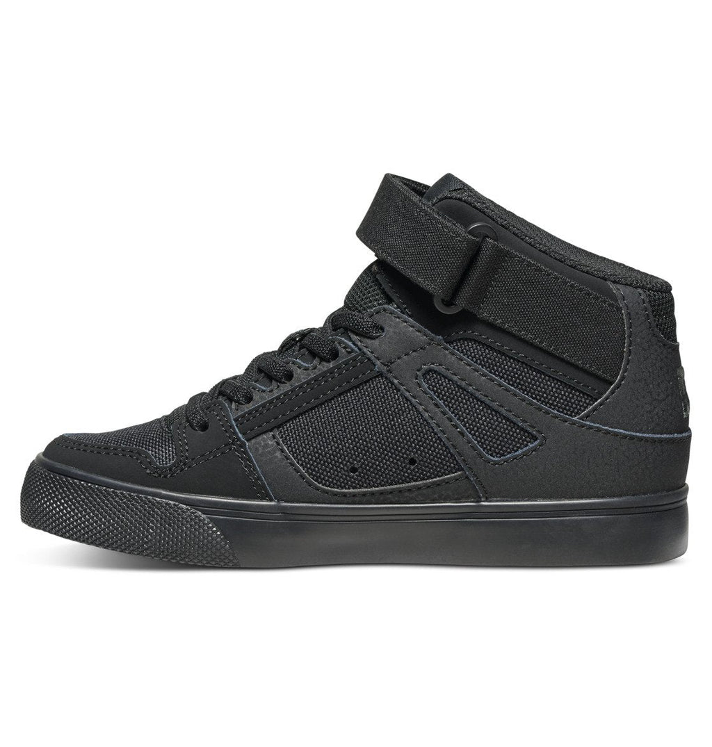 A side view of the DC Shoes Kids’ Pure High Elastic Lace High-Top Shoes in black, featuring a textured sole, mesh panels, and an ankle strap secured above the laces, displayed on a white background.