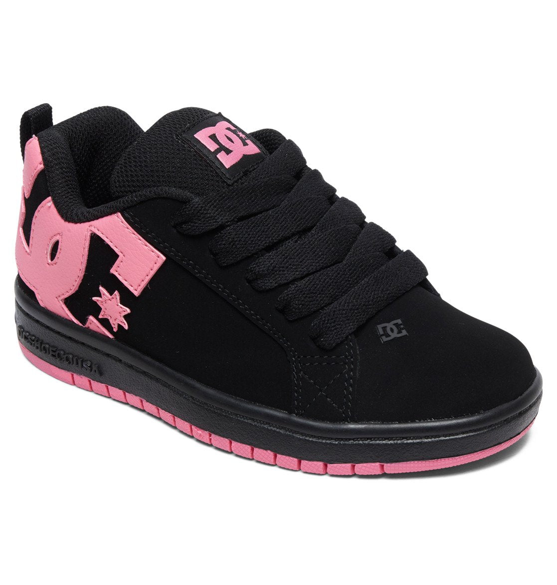 A black Kids’ Court Graffik Shoe by DC Shoes with thick black laces and vibrant pink accents on the sole, tongue, and oversized DC logo—ideal for those who love bold, skate-inspired style.