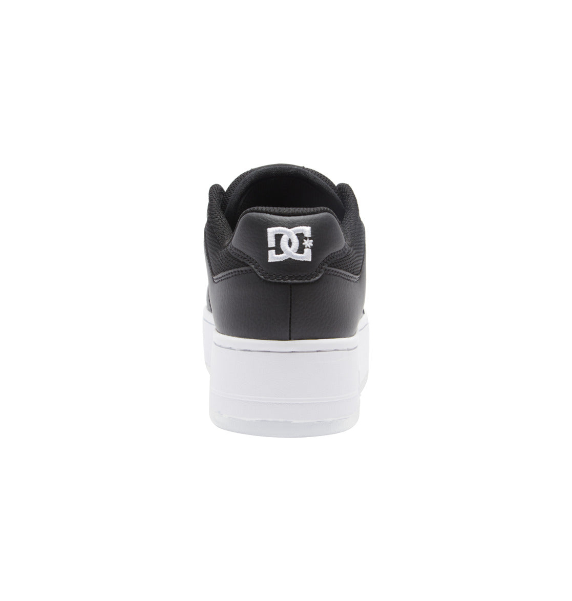 A rear view of the Women’s Manteca 4 Platform Shoes by DC Shoes, featuring a black upper and white sole. The white DC Shoes logo stands out on the heel against the plain white background, emphasizing these stylish women’s sneakers.