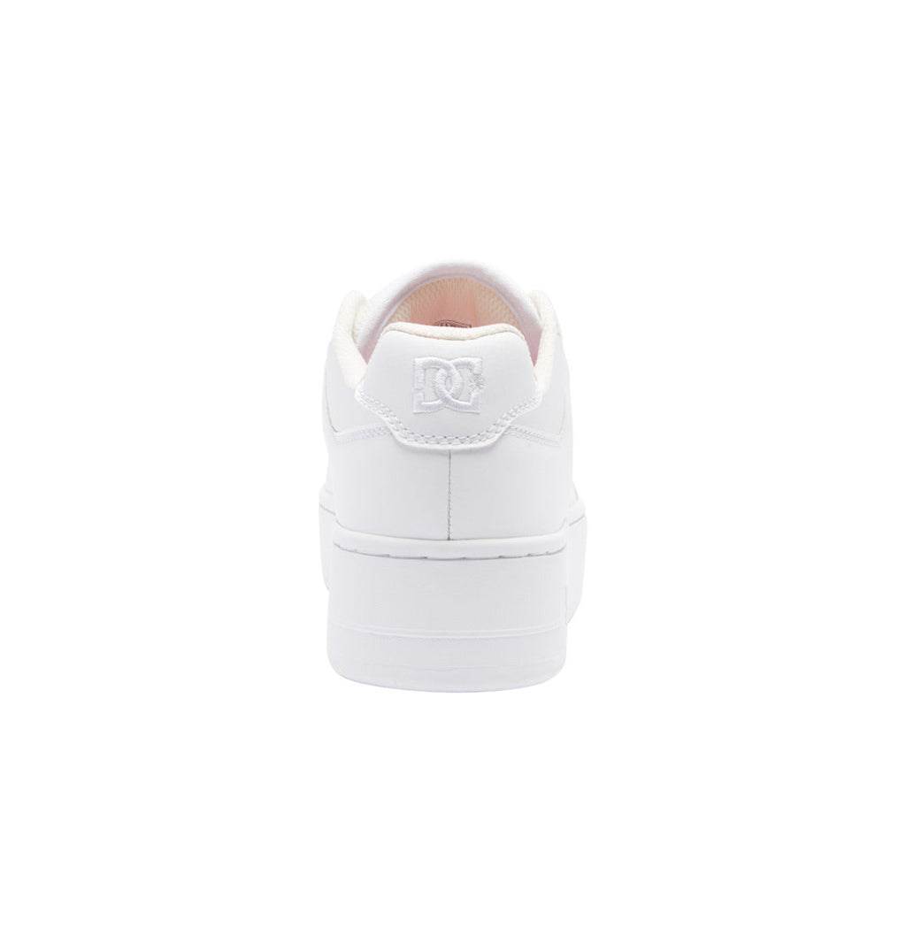 A white sneaker viewed from the back, showcasing the DC logo embroidered on the heel, with a white sole and minimal design on a plain white background—these are the Women’s Manteca 4 Platform Shoes by DC Shoes, perfect for anyone looking for stylish women’s platform sneakers with a clean and modern look.