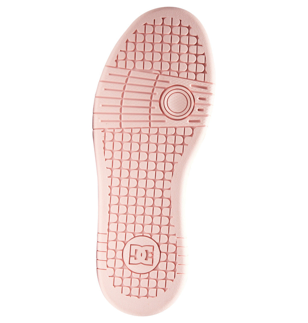 A pink sole featuring a textured grid pattern, a circular design near the arch, and an embossed DC Shoes logo at the heel highlights the performance-driven style of the Women’s Manteca 4 Shoes by DC Shoes.