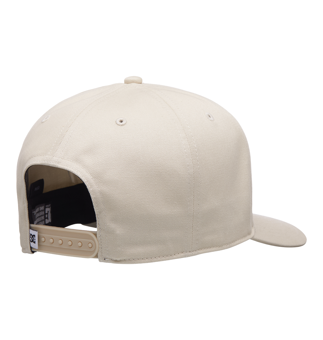 A rear view of the Men's Reynotts Cap by DC Shoes in beige shows DC branding, an adjustable plastic snapback strap, and part of the curved brim against a plain white background.