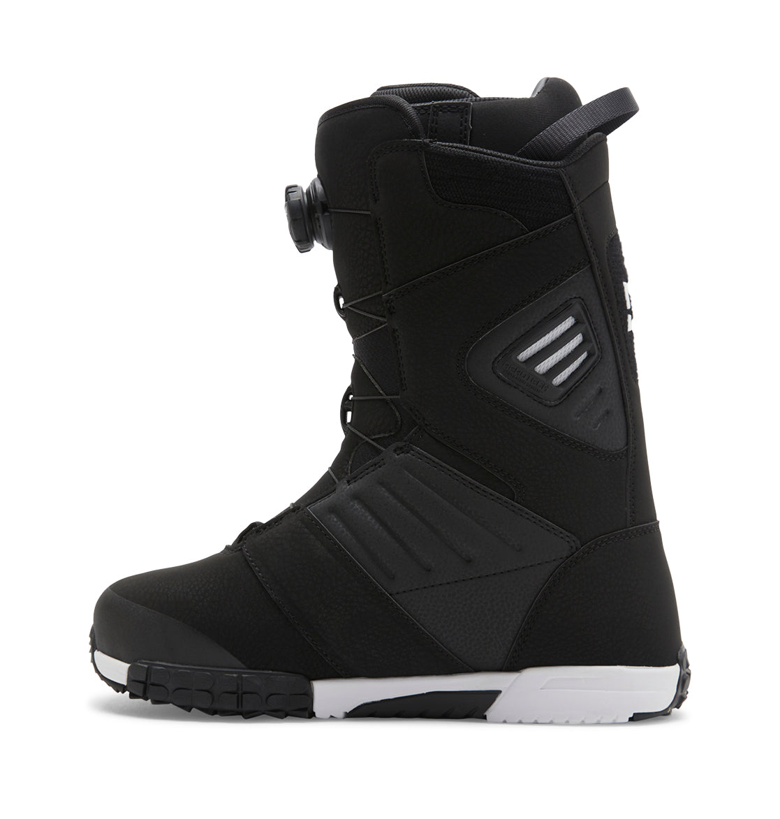 A side view of the Men’s Judge BOA® Snowboard Boots by DC Shoes, in black with a white sole, showcasing a Dual Zone BOA® Fit System dial closure and textured detailing on the upper and heel.