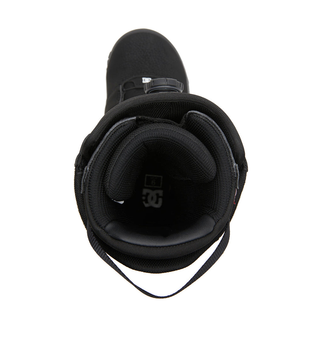 Top view of a black Men’s Judge BOA® Snowboard Boot by DC Shoes, showcasing padded lining, a pull tab at the back, and the visible DC logo inside the heel area. Engineered for performance with a sleek profile, this snowboard boot is photographed against a white background.