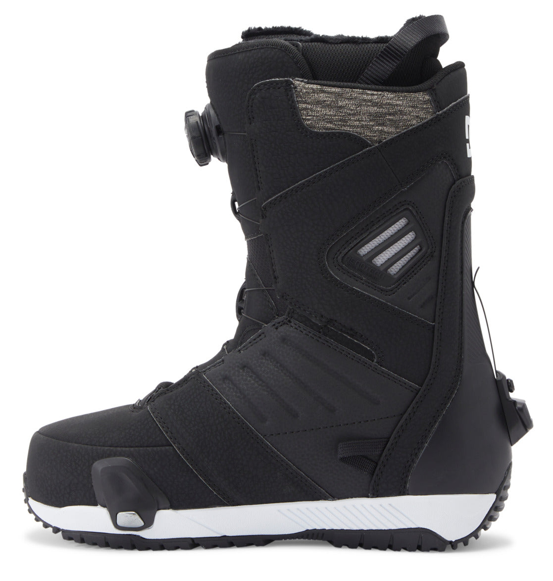 The Men’s Judge Step On® BOA® Snowboard Boots by DC Shoes feature a black, textured surface with detailed side panels and a white-and-black sole. Designed for comfort and support, these boots include a padded upper section and utilize the BOA® Fit System dial closure for easy adjustments.