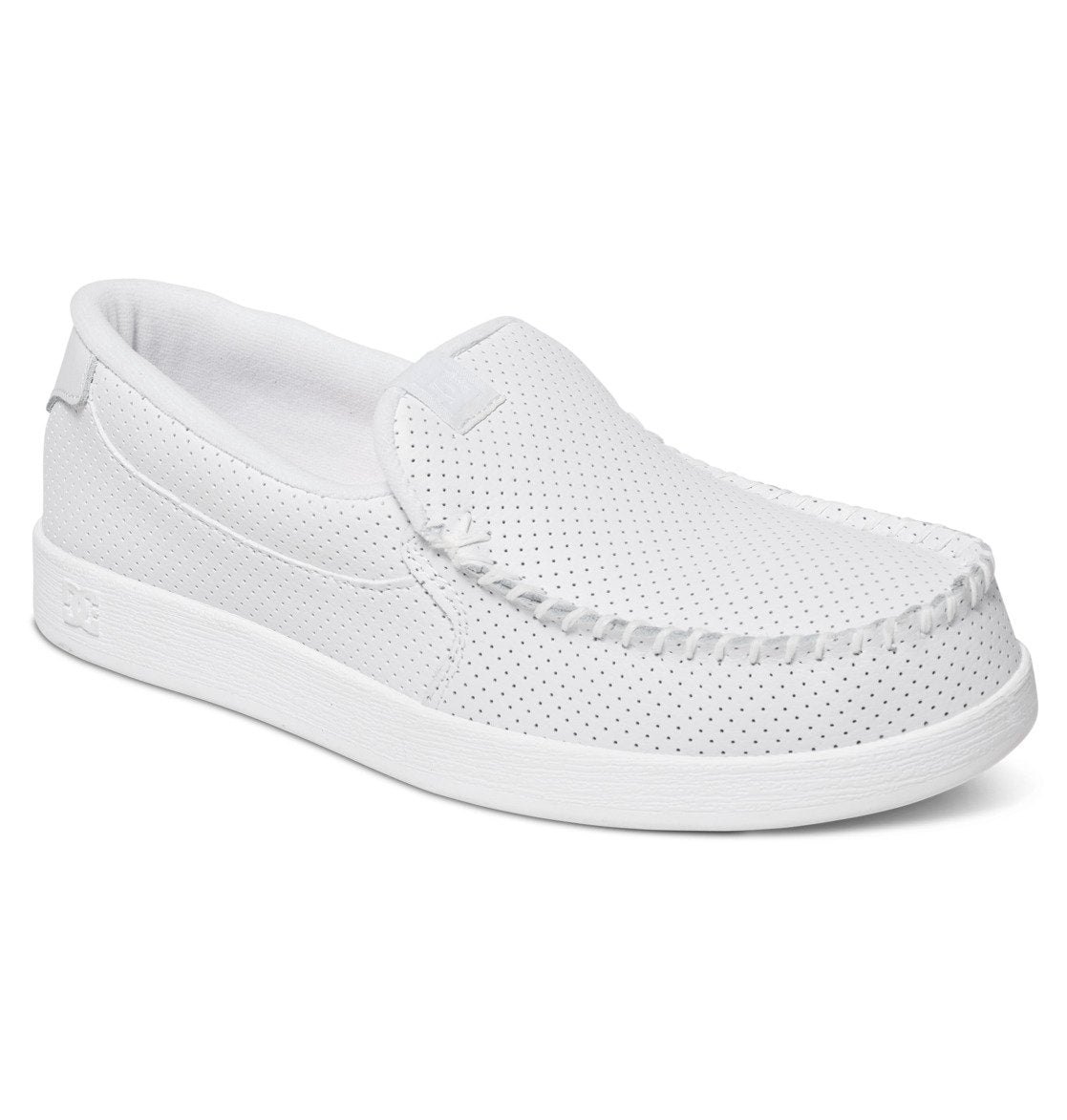 The Men’s Villain Slip-On Shoes by DC Shoes feature a lightweight white design with perforated detailing, visible stitching around the toe, and a flat sole—making them a comfortable and stylish choice for casual everyday wear.