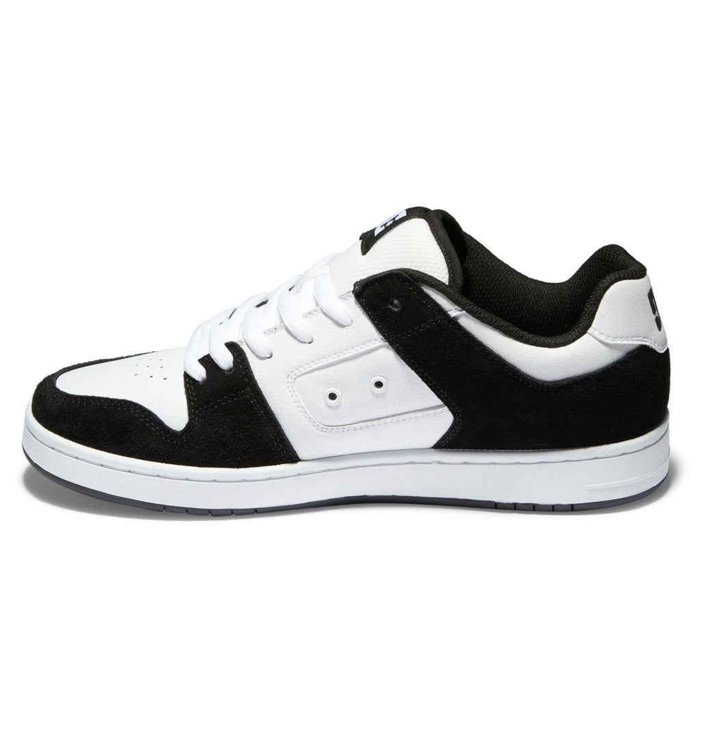 The DC Shoes Men’s Manteca 4 Shoes are black and white low-top sneakers inspired by classic skate footwear, featuring white laces, a white sole, and black accents on the toe, heel, and midfoot for modern comfort reminiscent of the original DC Manteca.