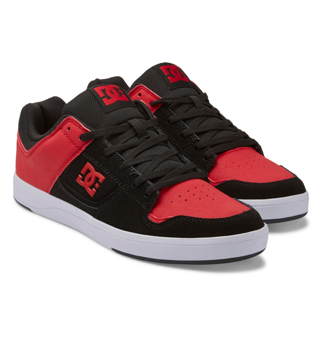 Men’s DC Cure Shoes by DC Shoes feature a striking black and red color scheme, white soles, black laces, and a durable leather upper, with the iconic DC logo displayed on both the side and tongue—making them the perfect choice for stylish everyday wear.