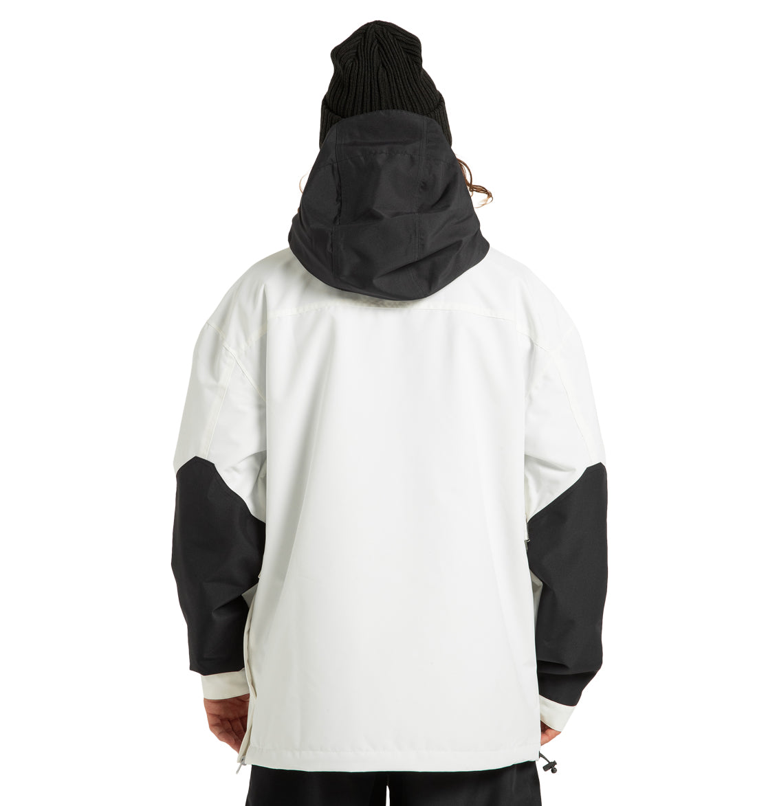 A person wearing a black beanie and the DC Shoes Mens’ DC-43 Anorak Jacket—a lightweight jacket made from recycled polyester—is standing with their back to the camera against a plain background.