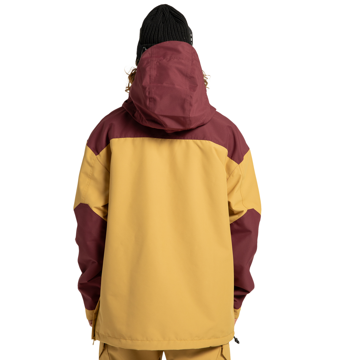 A person stands with their back to the camera against a plain white background, wearing the DC Shoes Men’s DC-43 Anorak Shell Jacket in yellow and maroon with a hood and matching pants. They also have on a black knit beanie.