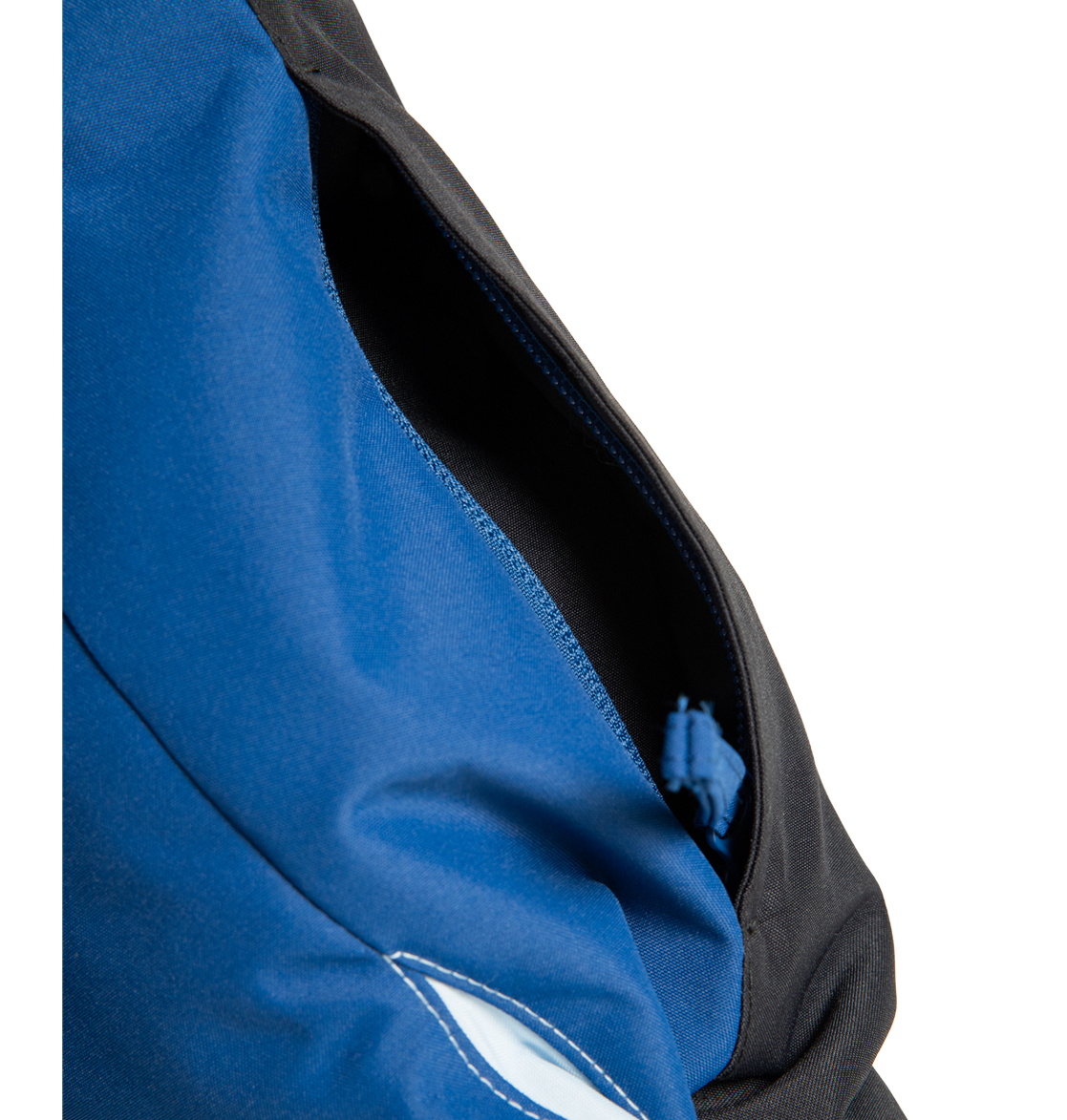 A close-up of a partially open zipper pocket on the DC Shoes Men’s Defiant Insulated Jacket in blue and black fabric, showing the zipper pull inside.