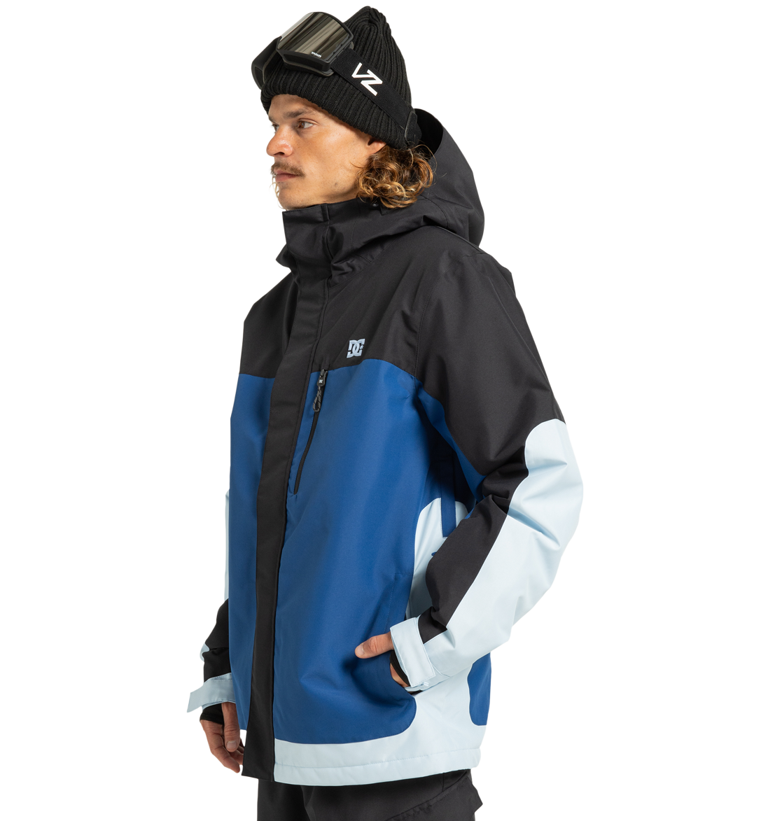 A man in a black beanie and goggles wears the DC Shoes Men’s Defiant Insulated Jacket in black, blue, and light blue. Crafted from recycled polyester with durable Weather Defense 10 technology, he faces left against a plain white background, confidently showcasing this winter essential.
