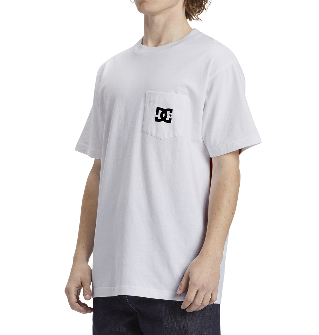 A man wears the Men's DC Star Pocket Tee by DC Shoes, a soft cotton white skate shirt with a small black logo on the chest pocket, relaxed fit, paired with dark pants and set against a plain white background.