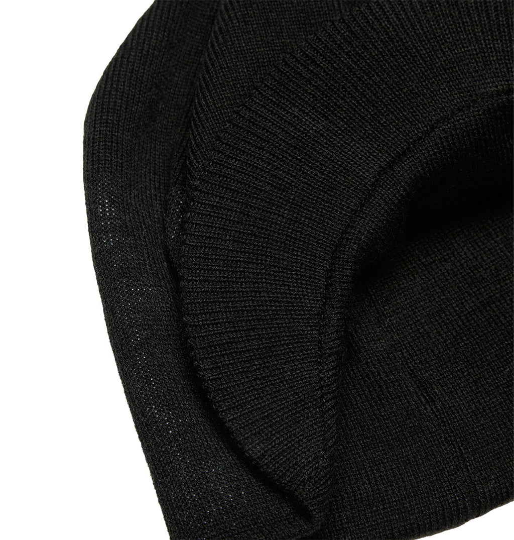 A close-up of the DC Shoes Big Star Visor, a black knitted beanie hat with a folded edge and textured ribbed fabric, showcasing classic knit construction and subtle DC Shoes branding.