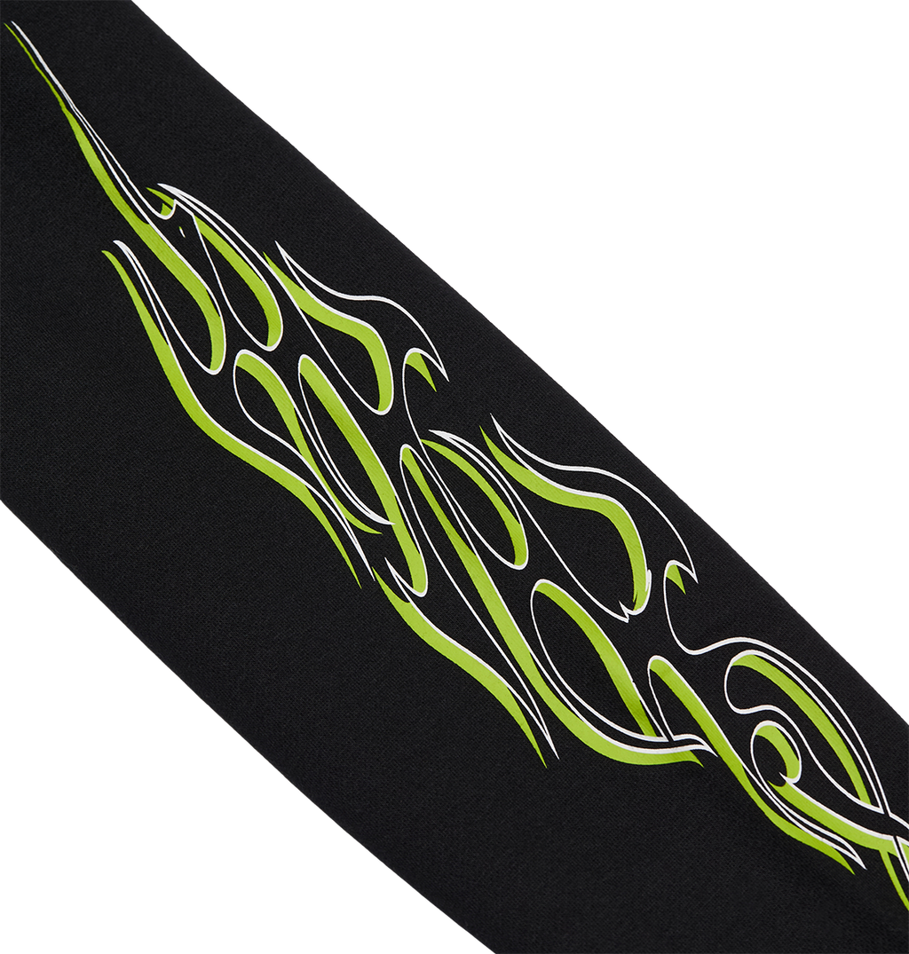 The DC Shoes Side Flame Hoodie Youth is a black fleece hoodie with a neon green and white tribal flame design running diagonally across it.