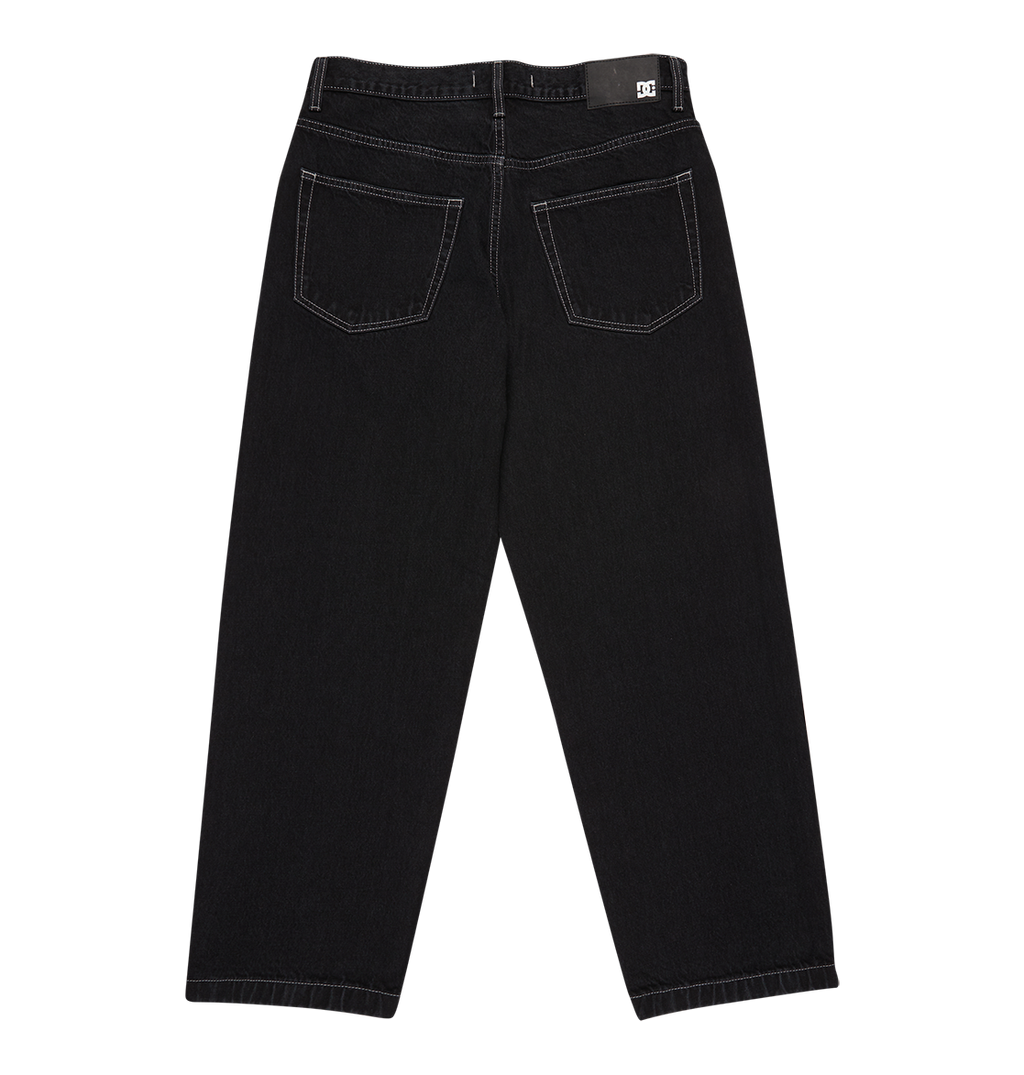 Back view of DC Shoes Men's Baggy Denim Pant in black heavyweight denim with white stitching, two back pockets, and a black waistband label, shown on a white background.