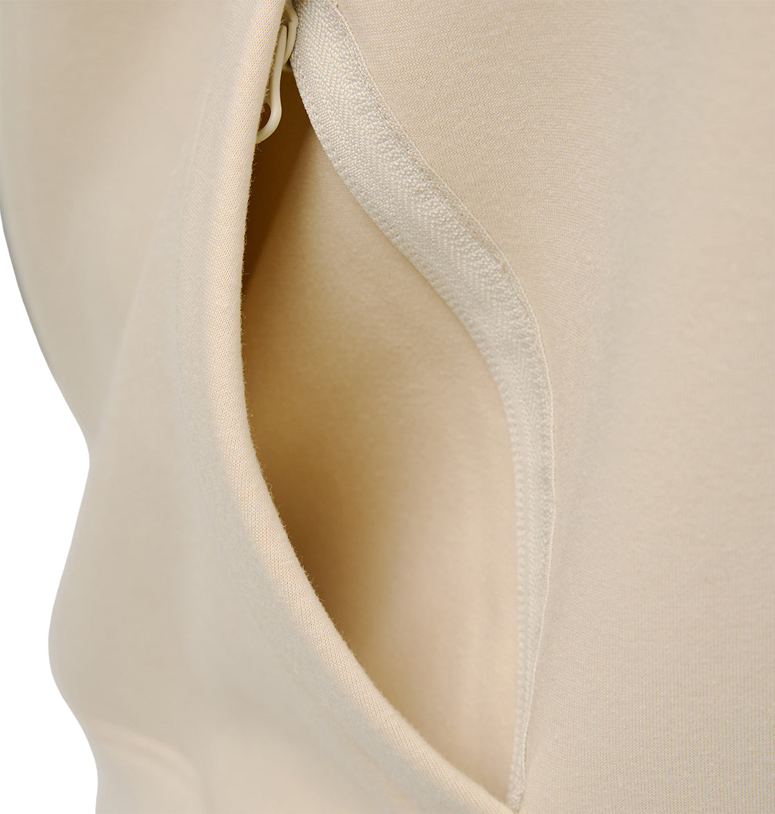 Close-up of the DC Shoes Snowstar garment in beige, highlighting the stitching and inside of a pocket—engineered for comfort and dependable weather protection.