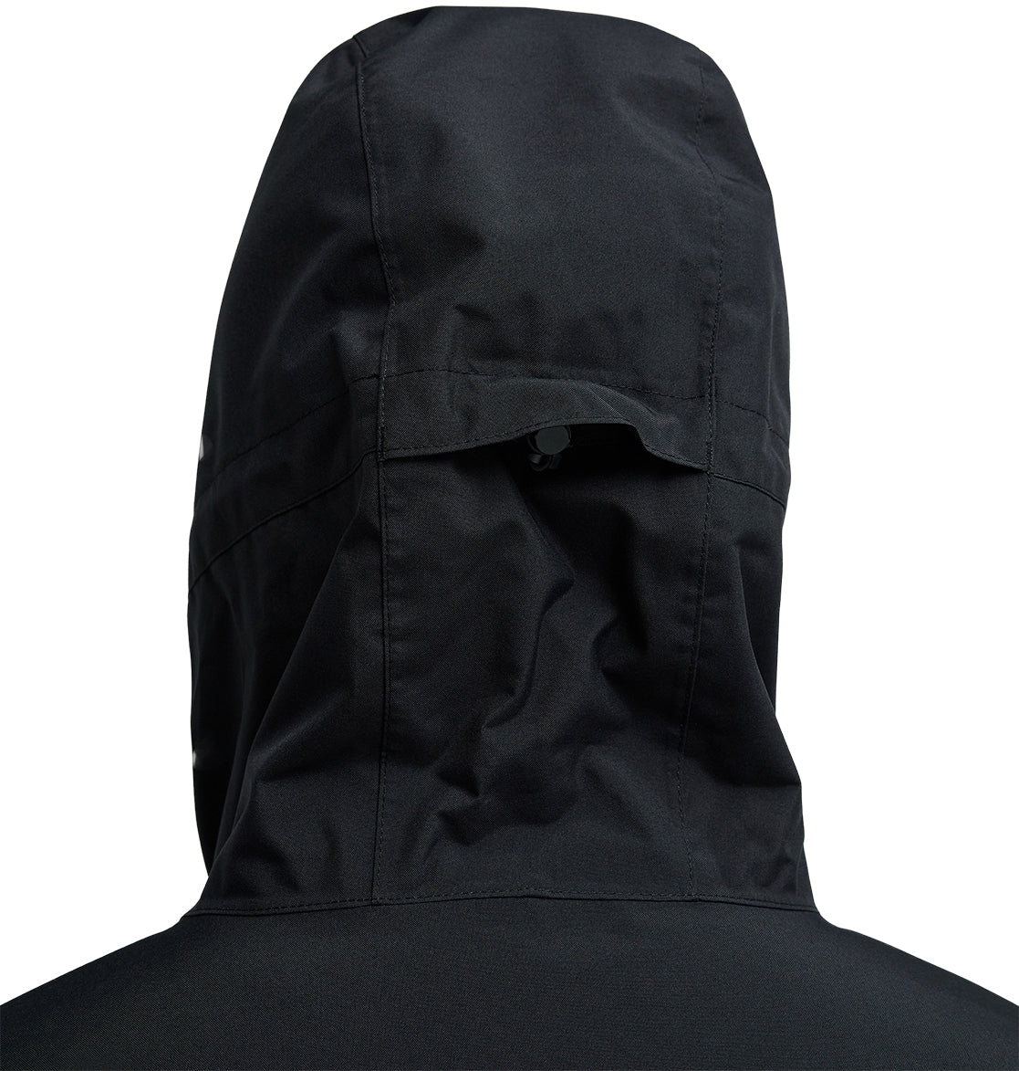 Close-up of the back of the black DC Shoes Basis Jacket 10K with hood, highlighting the intricate stitching details and a small tab or flap near the top center of the hood.