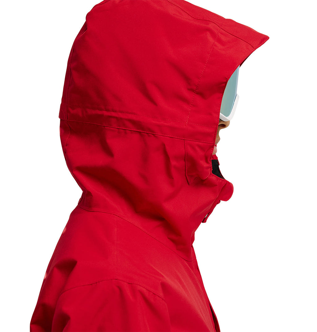 Person in a red DC Shoes Basis Jacket 10K with a hood and white ski goggles, shown in profile facing right against a white background.