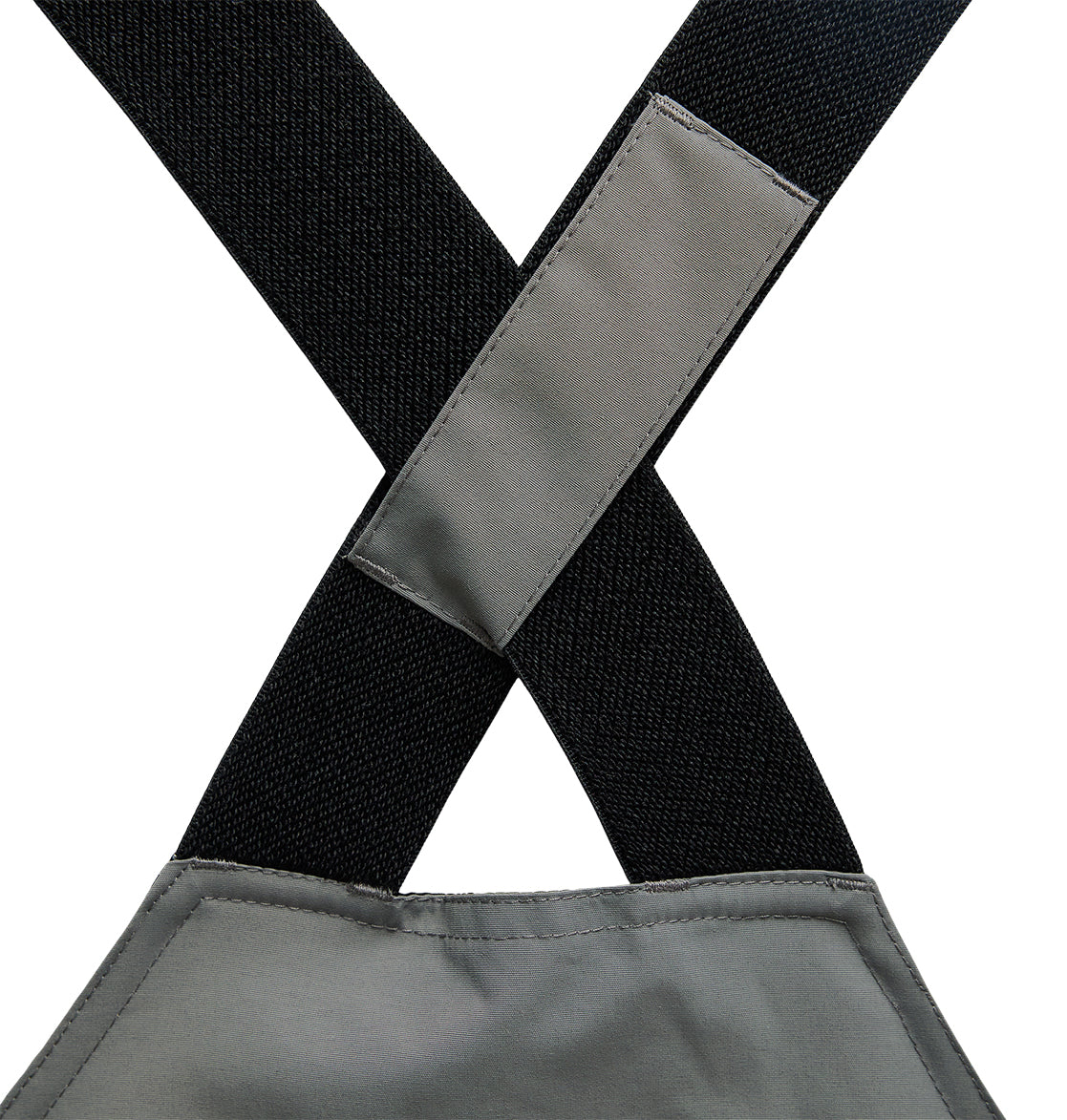 Close-up of two black straps on the DC Shoes Mountain Lab Bib 20K crossing in an X shape, secured by a gray fabric patch, with part of the gray bib visible at the bottom—designed to provide breathable protection for comfort during any task.