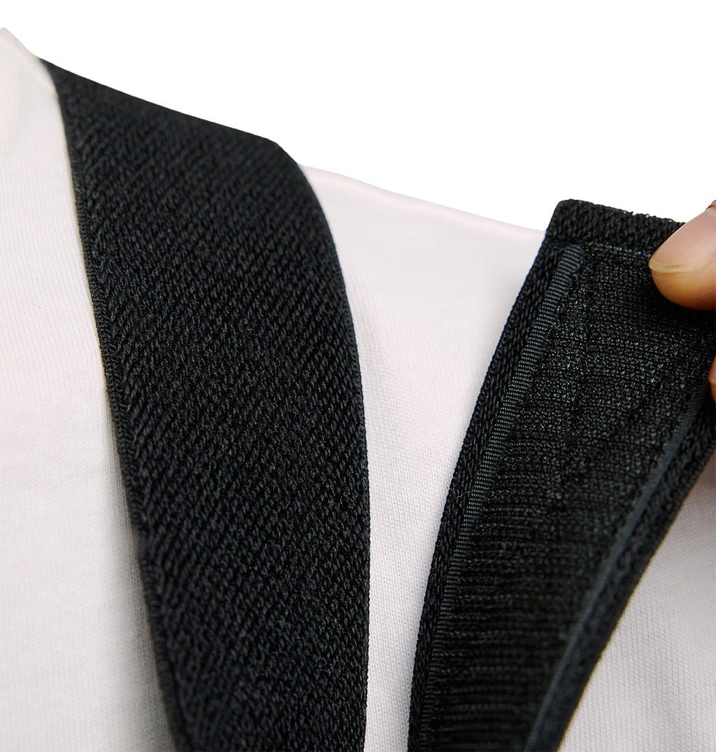 A close-up of a person adjusting the Velcro strap of the Docile Bib 10K by DC Shoes, worn over a white shirt, highlighting its breathable protection for lasting comfort throughout the day.