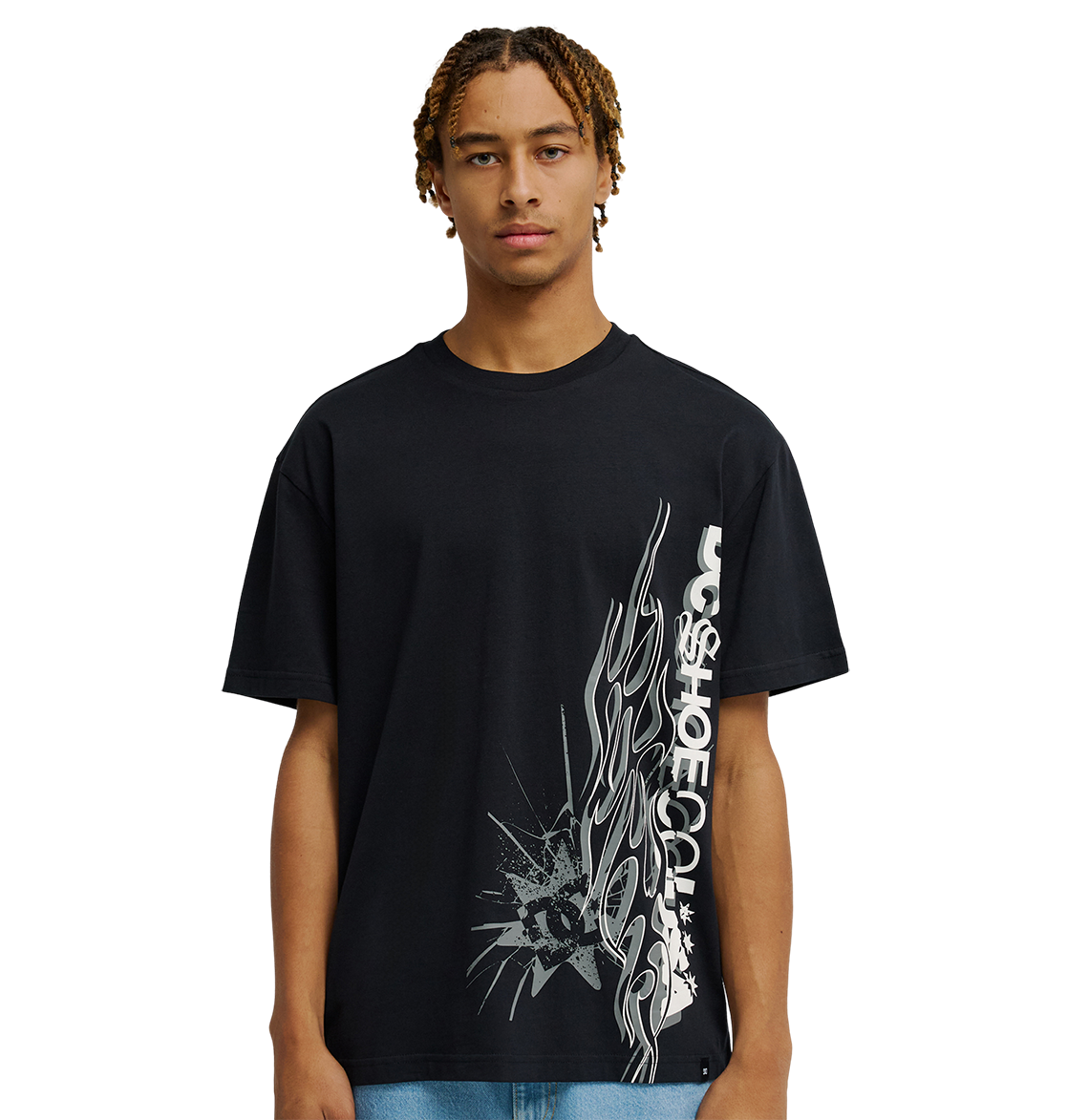 A young man stands against a plain white background, facing forward with a neutral expression, wearing the Men's DC Side Flame Tee from DC Shoes—an eye-catching black graphic t-shirt showcasing bold white abstract graphics and signature DC SHOES CO. artwork, perfect for his next skate sessions.